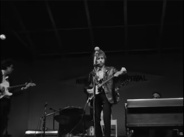 A frame from a video of Bob Dylan performing "Like a Rolling Stone" at the 1965 Newport Folk Festival. Copyright holder unknown